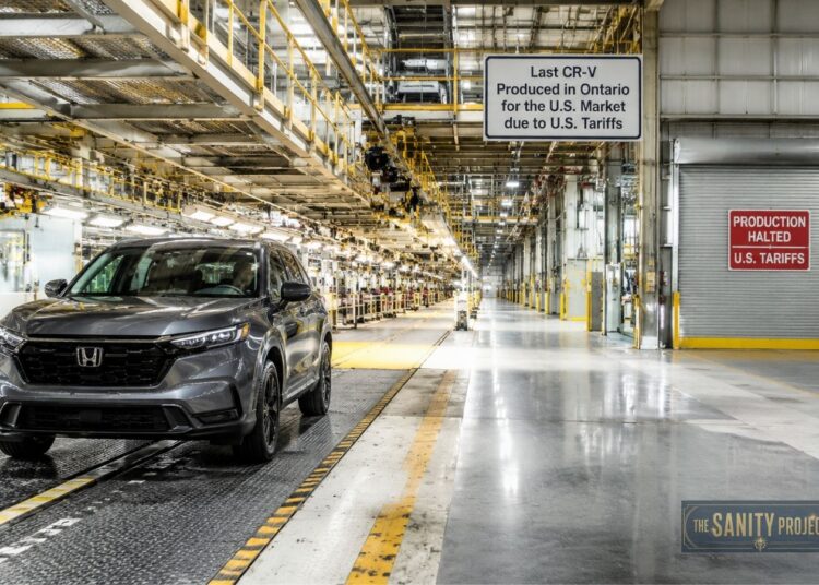 A gray Honda CR-V sits on a factory floor under bright lights. Signs mark it as the last U.S.-bound model made in Ontario due to tariffs, highlighting the broader industry shifts in lithium battery comparison, like LFP vs NMC battery choices.