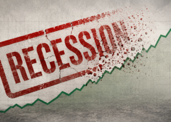 A green upward-trending line graph cuts through a cracked red “RECESSION” stamp, breaking apart the word into debris—symbolizing economic recovery or growth overcoming a Canada Recession 2026. The background features a worn, concrete texture.